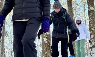 estonia snowshoe hiking group winter forest trail